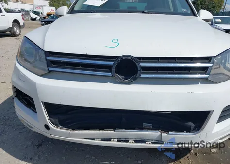 2013 Volkswagen Touareg Tdi Lux z USA, uszkodzony, nr VIN WVGEP9BP7DD006100